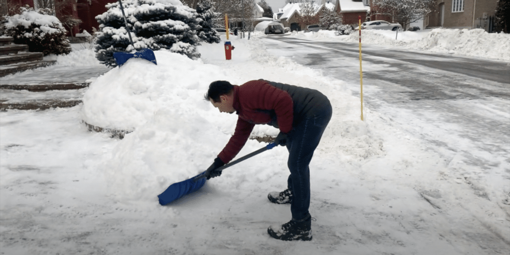 back pain shoveling snow